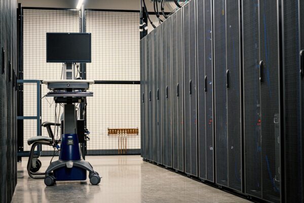 Aisle of server racks in a data centre