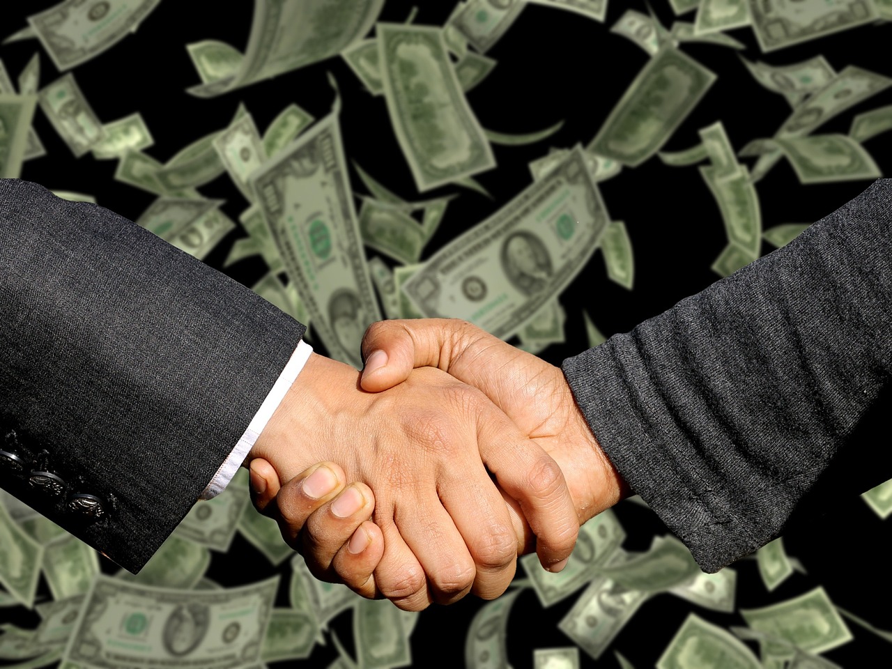 Business handshake representing B2B enquiries converted via website