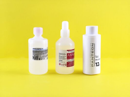Labelled bottles on a yellow background