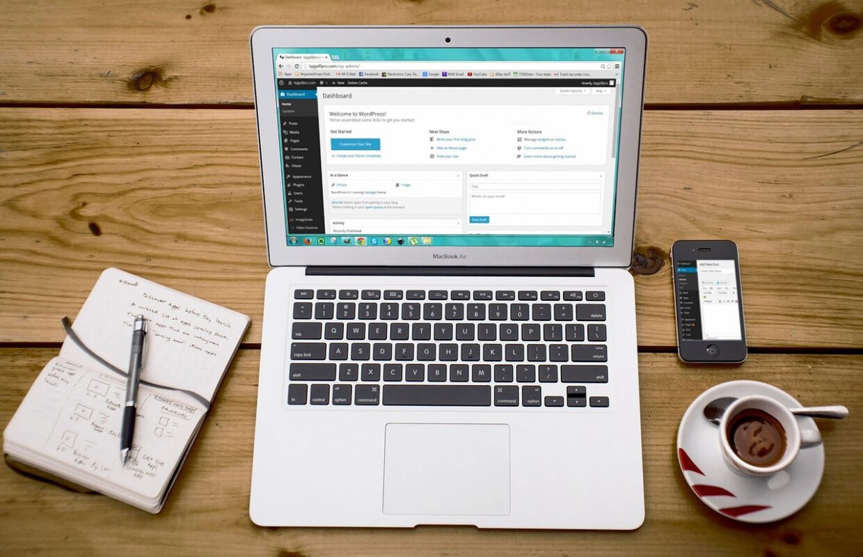 Laptop showing small business website design and launch planning