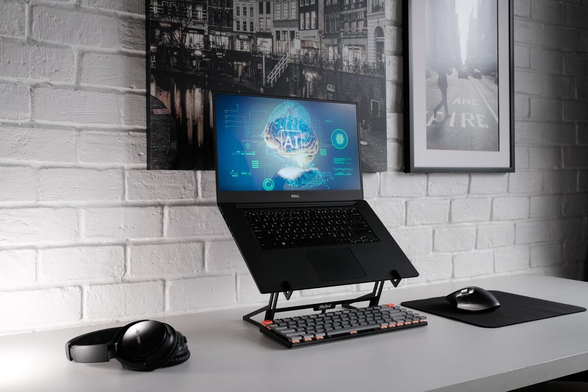 Small business owner using practical AI tools on laptop