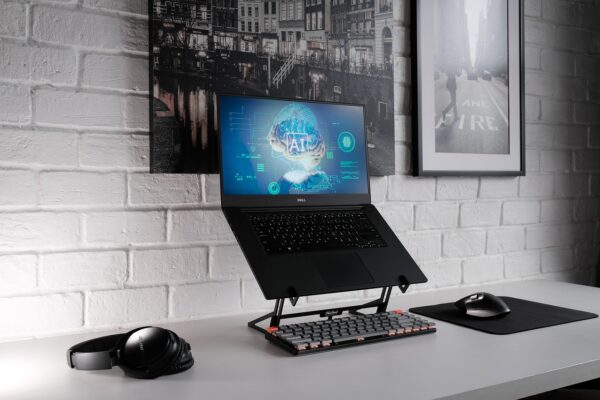 Small business owner using practical AI tools on laptop