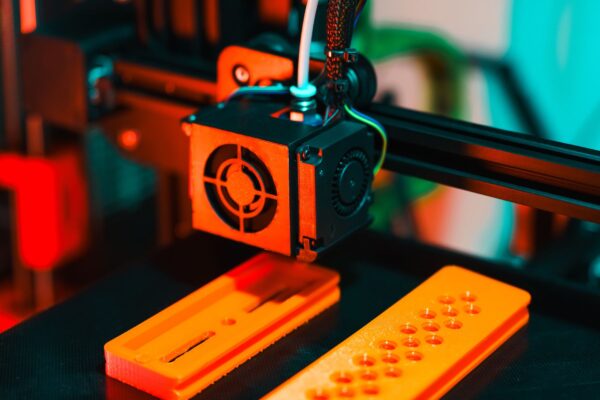3D printer building a plastic part layer by layer