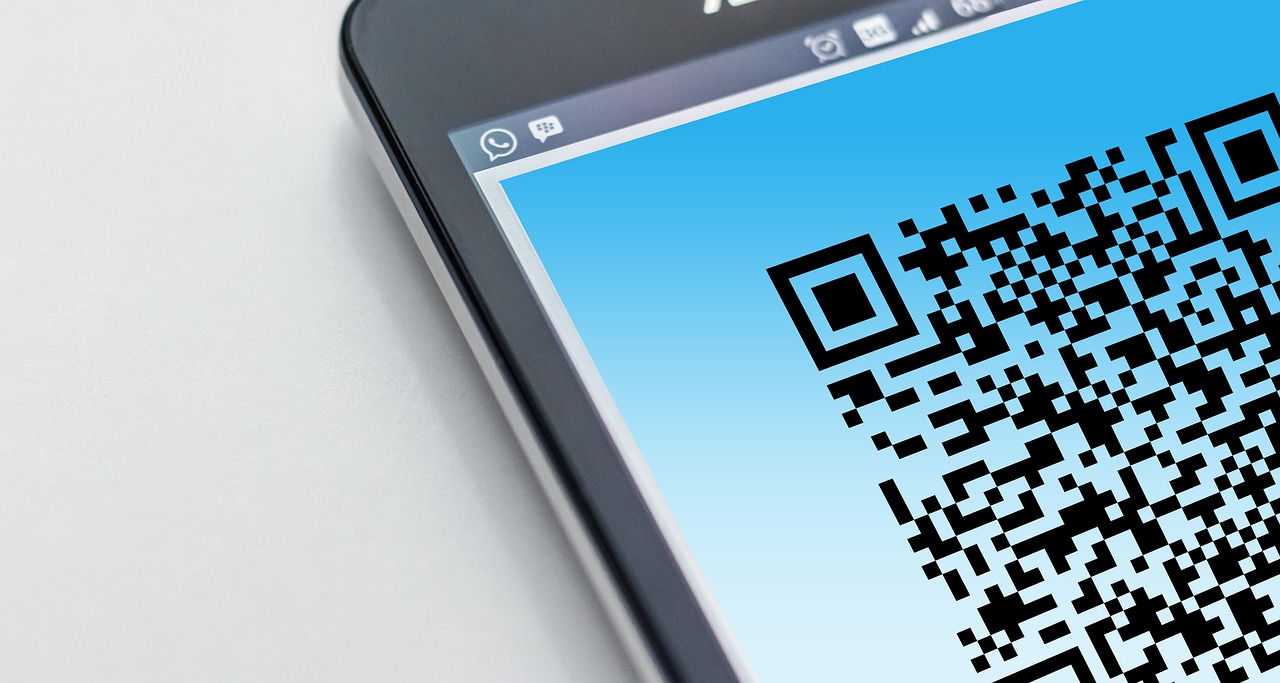 Phone scanning QR code on laser-marked industrial part