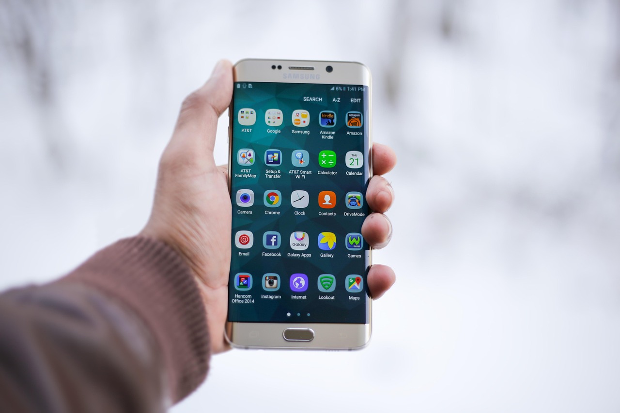 Hand holding phone with instant enquiry notification